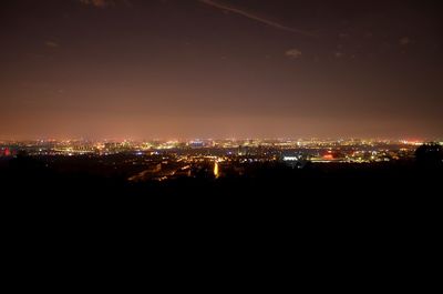 Illuminated cityscape at night