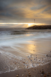 Scenic view of beach during sunset