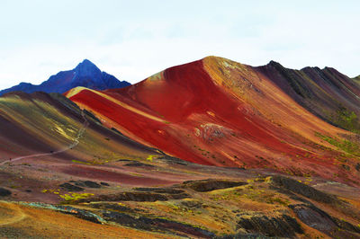 Scenic view of mountain against cloudy sky