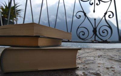 Close-up of books on a balcony - colonno, como, italy