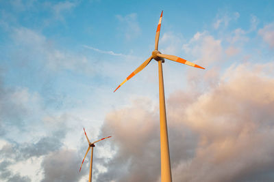 Low angle view of traditional windmill against sky