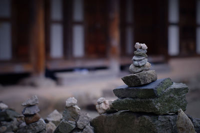 Close-up of stones stacked outside building