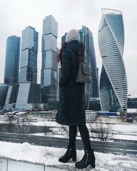 Full length of woman in city during winter