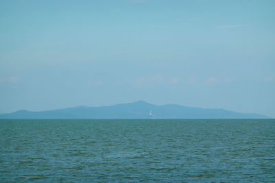Scenic view of sea against blue sky