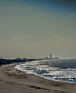 View of calm beach against the sky