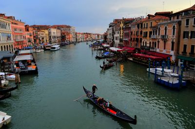 High angle view of canal amidst buildings in city