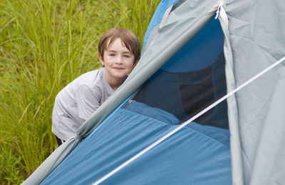 Full length of boy near tent