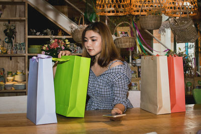 Young woman looking at store