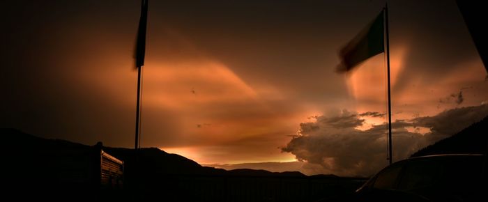 Silhouette built structure against sky during sunset