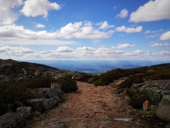 Scenic view of mountains against cloudy sky