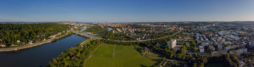 Panorama of the city of regensburg in bavaria on clear summer day with danube river and autobahn a93