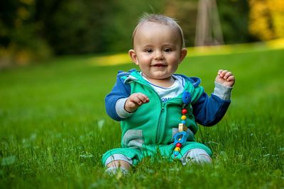 Portrait of smiling boy on grass