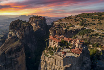 High angle view of buildings on mountain against sky during sunset