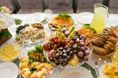 Banquet table with food and snacks at a wedding, birthday or party