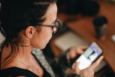 Close-up of woman using mobile phone