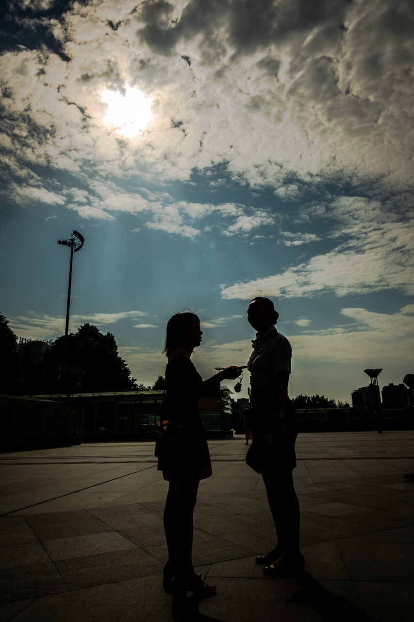 SILHOUETTE PEOPLE ON STREET AGAINST SKY DURING SUNSET