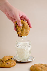 Cropped hand of person preparing food