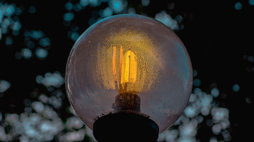 Close-up of illuminated light bulb