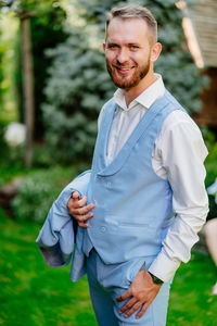 Portrait of young man standing outdoors