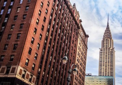 Low angle view of modern buildings against sky