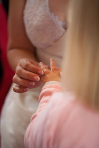 Close-up of woman holding hands