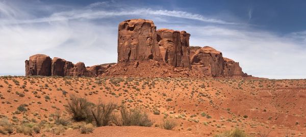 Rock formations on landscape against sky