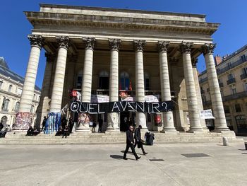 People in front of historical building