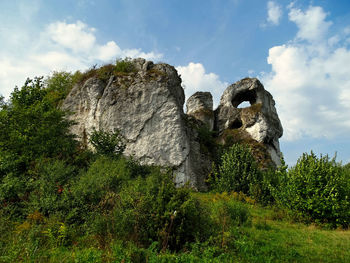 Low angle view of rocks against sky