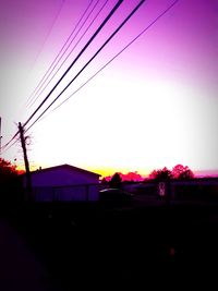 Silhouette buildings against sky during sunset