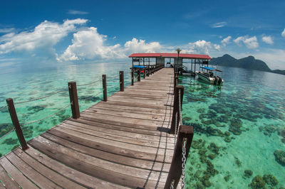 Pier over sea against sky