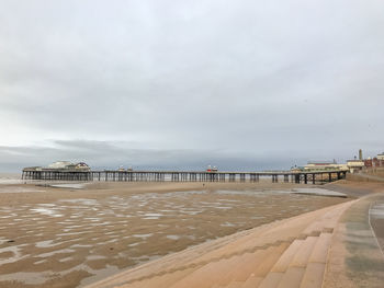 Pier over sea against sky