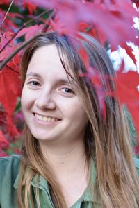 Close-up portrait of smiling young woman