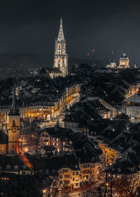 Illuminated buildings in city at night