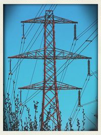 Low angle view of electricity pylon
