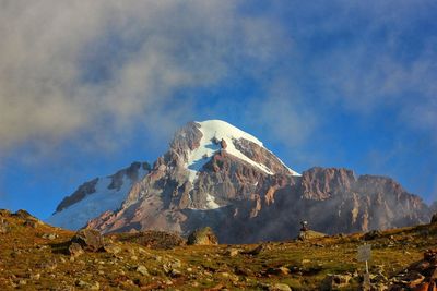 Panoramic view of snowcapped mountains against sky