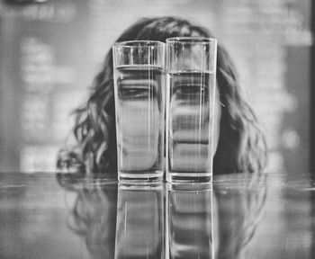 CLOSE-UP OF REFLECTION OF WATER IN GLASS