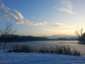 Scenic view of snow covered mountains against sky