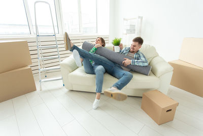 Young men sitting on sofa