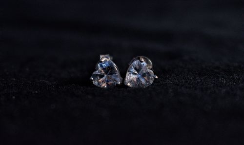 Close-up of wedding rings on table