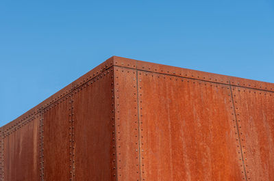 Low angle view of building against blue sky