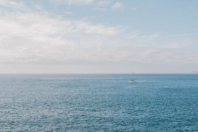 Seascape of single lone sailboat in the puget sound pacific ocean sea