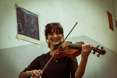 Portrait of female violinist smiling