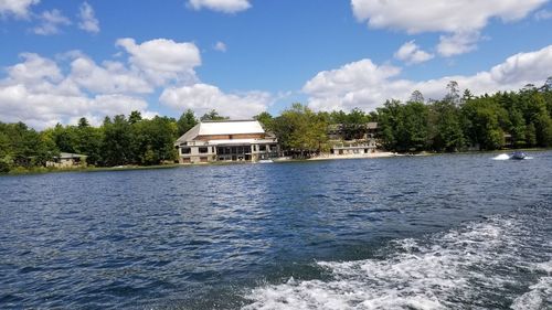 Building by sea against sky