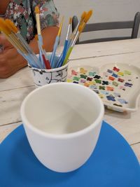 High angle view of paintbrushes on table