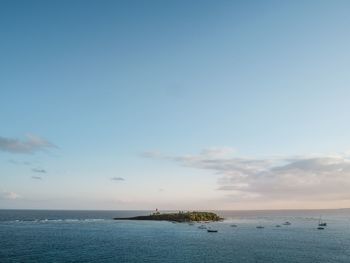 Scenic view of island in sea at guadeloupe against sky