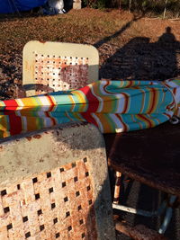 High angle view of multi colored chairs on table