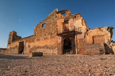 Low angle view of old building against sky