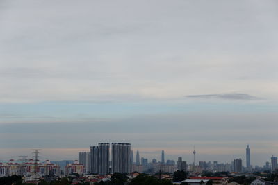 Buildings in city against sky