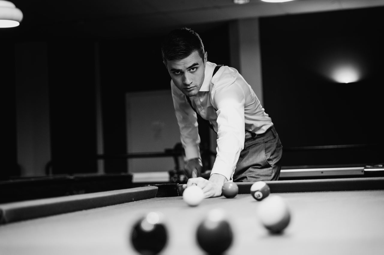 one man only, only men, one person, playing, sport, pool table, concentration, pool ball, pool - cue sport, adults only, leisure activity, ball, competition, pool cue, leisure games, adult, indoors, men, aiming, people, snooker, snooker ball, sportsman, cue ball, match - sport, taking a shot - sport, day