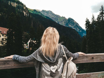 Rear view of woman looking at mountains